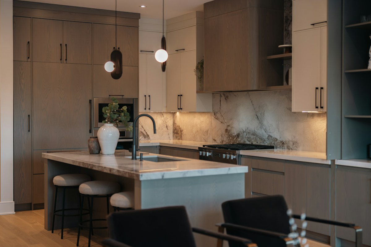 Modern kitchen with island and marble backsplash